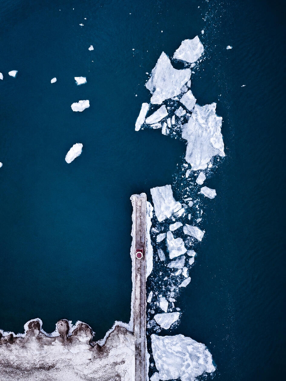 Aerial study of a lighthouse and breaking lake ice • Kenosha, Wisconsin