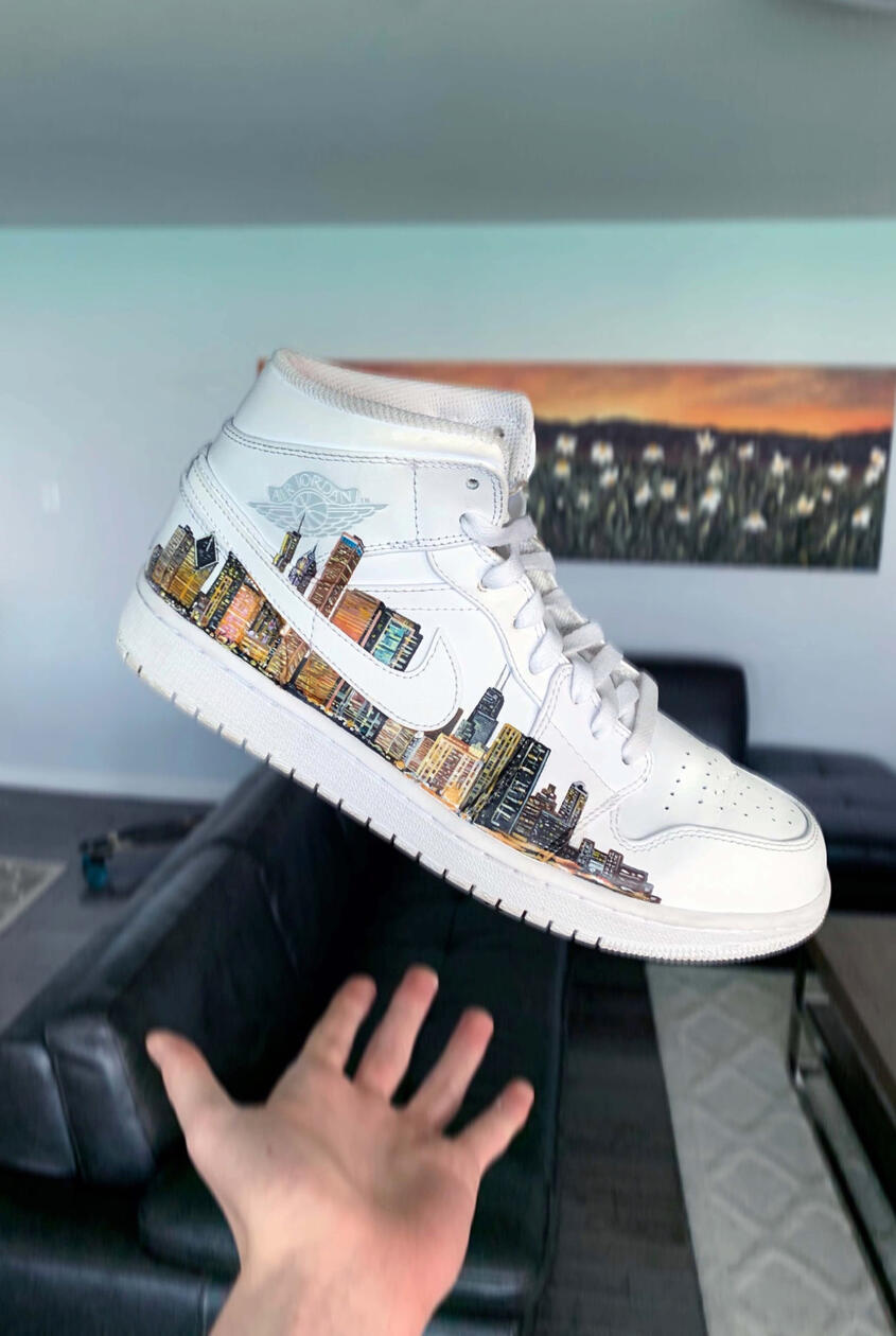 Custom Sneaker Art / Urban Cityscape · Acrylic leather paint on Nike sneakers A custom pair created for a friend from Chicago, extending the city skyline across both shoes. Photo after completing the first half of the Chicago skyline on the shoe.